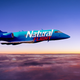 A Natural Light branded jet flying in the sky